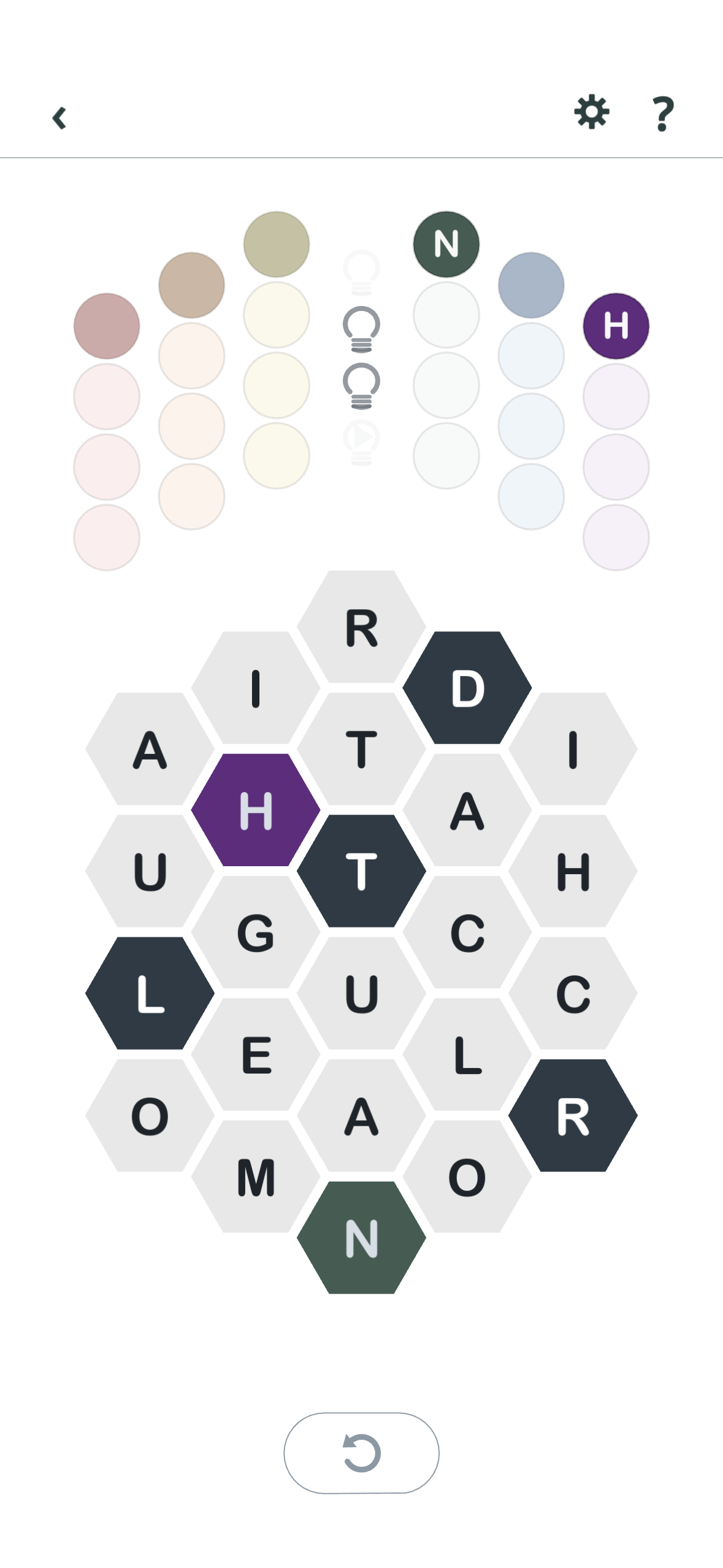 Textagons board with colored anchor letters revealed